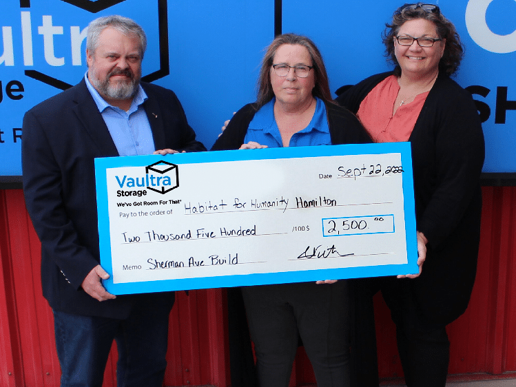 Vaultra Storage donating a check to Habitat for Humanity Hamilton!