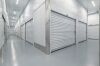 Interior hallway of Vaultra Storage facility lined with clean, secure indoor self-storage units available for rent