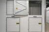 Stacked storage lockers at Vaultra Storage facility - secure, climate-controlled overhead storage units available for rent